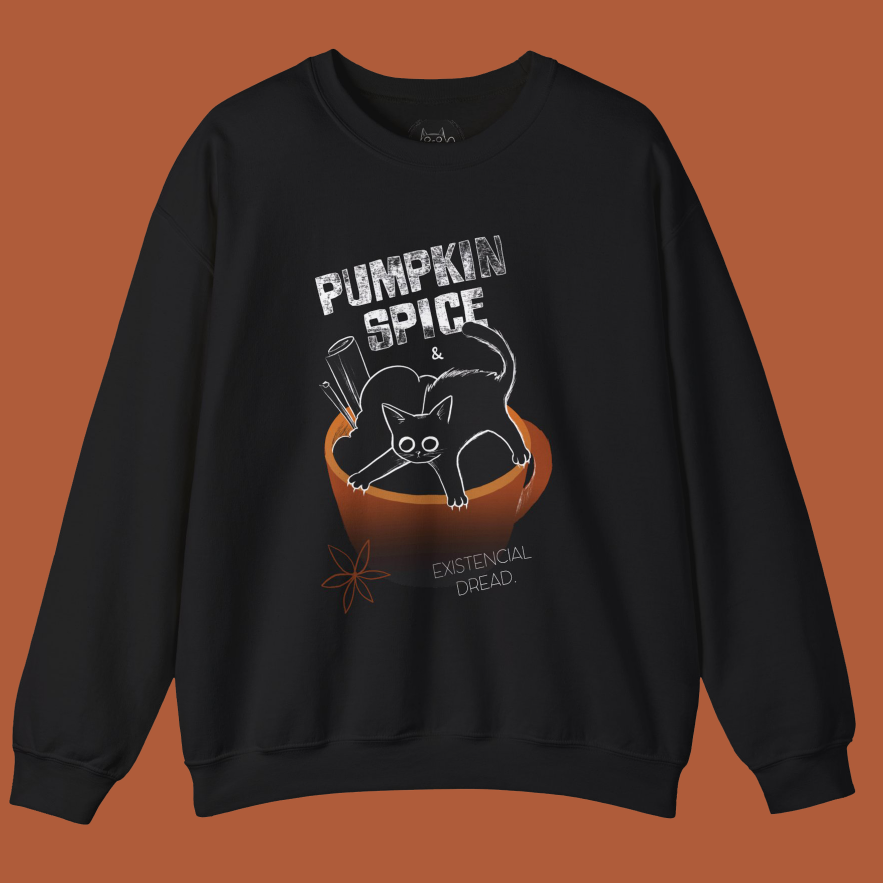 Black sweatshirt with a graphic of a cat a cup of pumpkin spice latte and text on a brown background