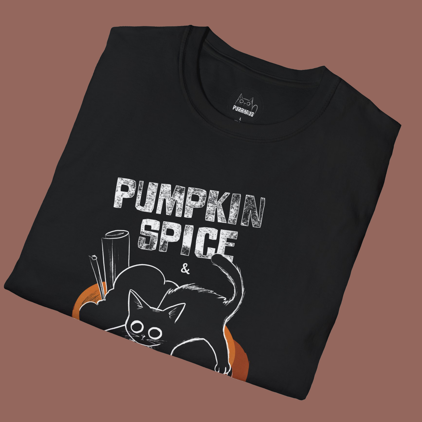 Black t-shirt with 'Pumpkin Spice' text and cat design on a brown background